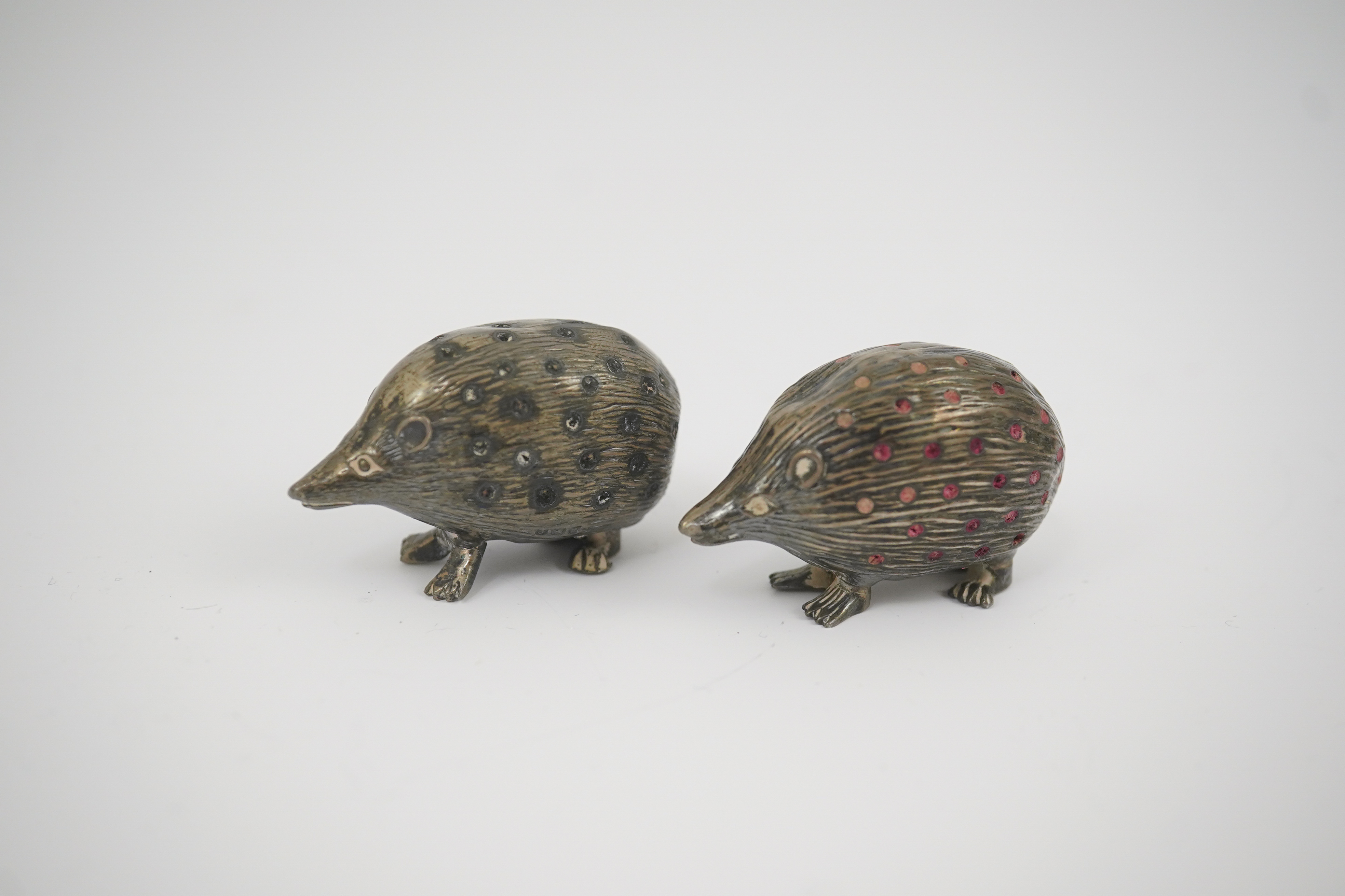 Two Edwardian silver novelty pin cushions, modelled as porcupines